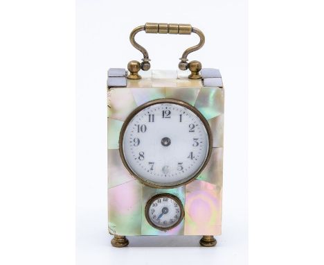 A late 19th Century miniature mother of pearl carriage alarm clock, swing handle, enamel dial and subsidiary hours dial, heig