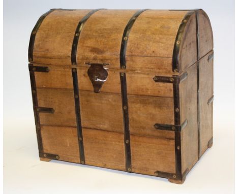 A miniature wooden domed trunk, metal bound, 35.5cm wide 34cm high