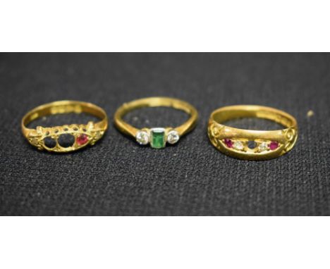 A diamond and ruby quintet ring, 18ct gold shank, central ruby missing, others diamond and emerald etc, all 18ct gold shanks,