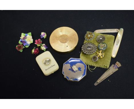 A silver and mother of pearl folding fruit knife; a quantity of late 19th, early 20th Century buttons; a white metal St Chris