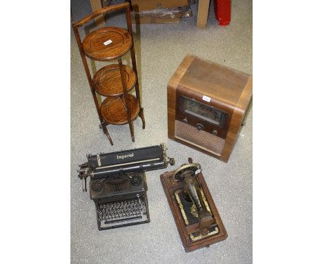 A Cossor 1930's radio; a Singer sewing machine; an Imperial typewriter; an oak cake stand (4) 