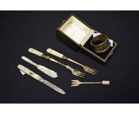 A silver and mother of pearl fruit knife, Sheffield, 1891; a silver napkin ring, other mother of pearl and silver items