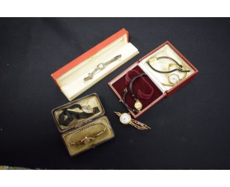Watches - a 9ct gold cased lady's wristwatch, unmarked rose metal expanding bracelet, case London 1921, 18.7g gross; another 