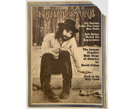 A Cat Stevens autographed Rolling Stone magazine front page in biro. There is a corner missing to the top right-hand side of 