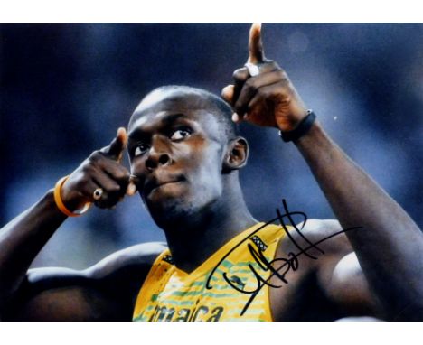 BOLT USAIN: (1986-     ) Jamaican Sprinter, the first man to win six Olympic Gold medals in sprinting. Signed colour 16 x 12 