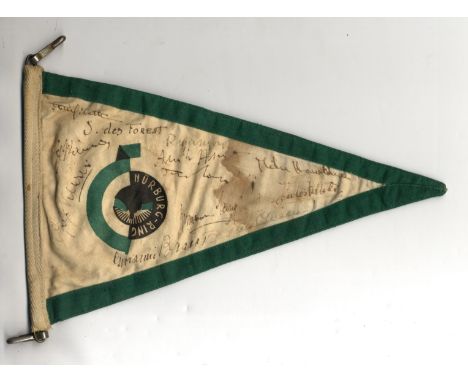 MOTOR RACING: A good vintage cloth pennant with green borders and bearing the circular emblem of the Nurburgring, individuall