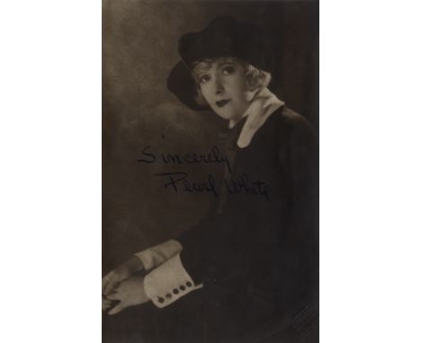 WHITE PEARL: (1889-1938) American Silent Film Actress. Rare vintage signed sepia 5 x 8 photograph of White seated in a half l