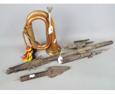 A copper and brass bugle with a tribal carving (A/F). [2]
