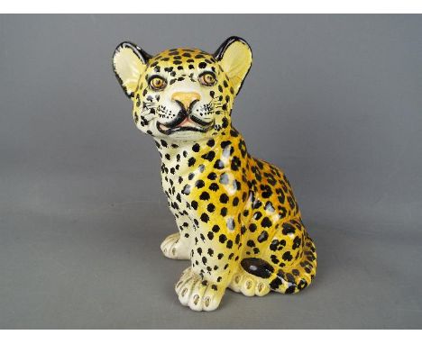 An Italian ceramic model depicting a leopard cub, impressed signature mark, approximately 26 cm (h)