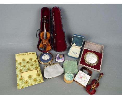 Lot to include two powder compacts one a Stratton example with inset Wedgwood jasperware plaque, a Liberty &amp; Co printed s