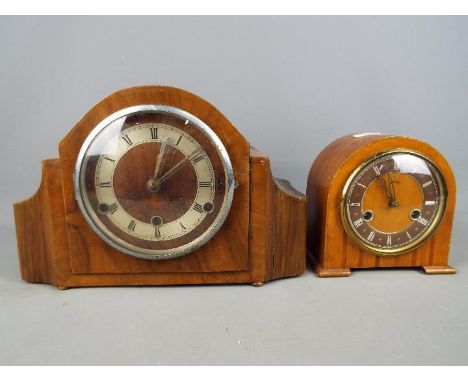 A wood cased mantel clock with Roman numeral chapter ring, movement marked 'British Anvil Perivale London 42224', with pendul
