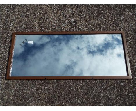 A vintage LMS wall or carriage mirror, the glass etched LMS and impressed to the frame, approximately 27 cm x 65 cm.
