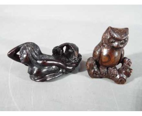 A vintage Japanese dark wood Netsuke depicting an Owl seated on a thick branch or log,  signed and a vintage Japanese dark wo