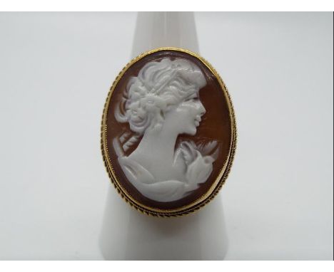 A 9ct yellow gold cameo ring, size R, head of ring measures approximately 2.6 cm x 2.1 cm, approximately 5.7 grams all in.