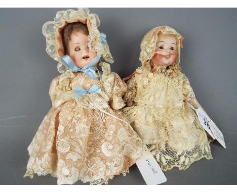 Catterfeldeer Puppenfabrik - a pair of ceramic faced dolls to include a Catterfelder Puppenfabric doll with painted eyebrows 