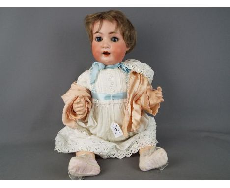 Heubach Koppelsdorf - a girl doll with ceramic face, painted eyebrows and lashes, moving blue sleeping eyes and open mouth wi
