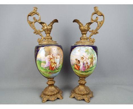 A large pair of decorative ewers, the body decorated with classical scenes, approximately 53 cm (h). [2] Condition Report: No