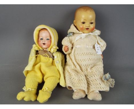 Armand Marseille - two Armand Marseille dolls. a ceramic faced doll with sleeping blue eyes, open mouth showing teeth with a 