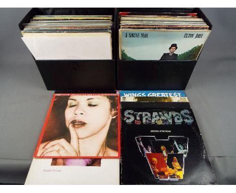 Two carry cases containing 12" vinyl records to include ABBA, Pink Floyd, New Order, Blondie, The Undertones, Bob Dylan and s