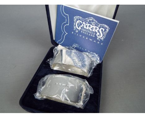 Two hallmarked silver napkin rings, Sheffield assay by Carrs of Sheffield, unused, cased with maker's leaflet, total silver w