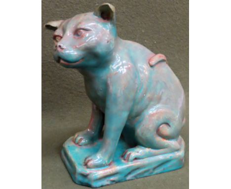 Della Robbia glazed ceramic seated cat, on plinth, stamped to underneath. App. 22cm H

Both ears have had some restoration, m