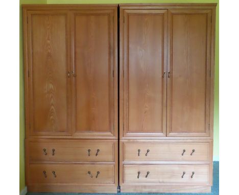 Pair of 20th century light oak two door wardrobes. App. 185cm H x 93cm W x 61.5cm D

Both appear in reasonable used condition