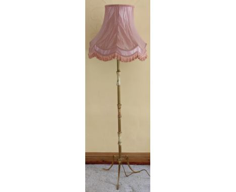 Onyx standard lamp, on tripod supports. App. 133cm H

Used condition, not tested for working 