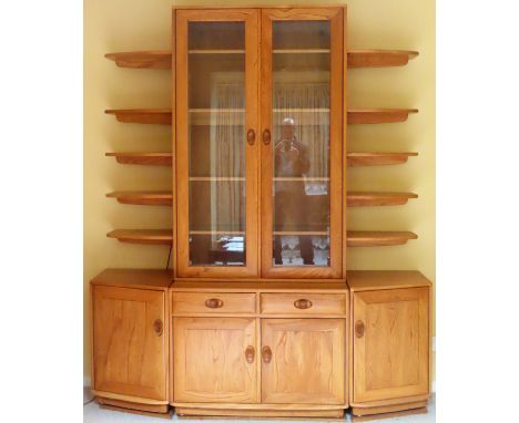 Ercol Golden Dawn light oak wall unit with shelves, sectional cupboard doors and drawers below. App. 218cm H x 181cm W x 45cm