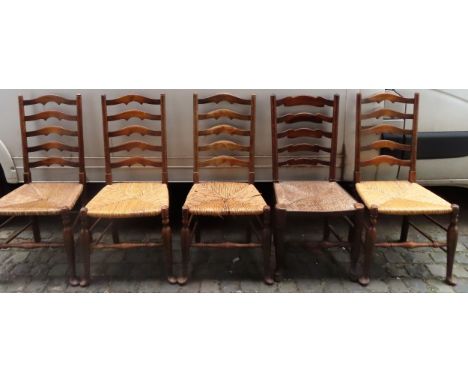 Set of four rush seated ladder back chairs, plus one other similar chair. App. 102cm H x 47.5cm W x 40cm D

Used condition, s