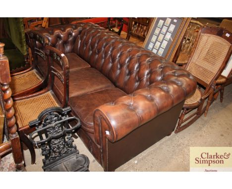 A leather upholstered button Chesterfield settee 