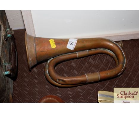 An antique copper and brass bugle