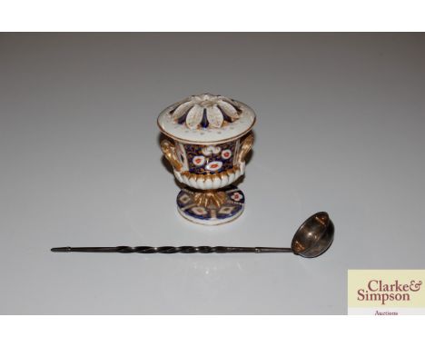 A 19th century Derby pattern urn shaped vase; and a white metal toddy ladle with twist handle 