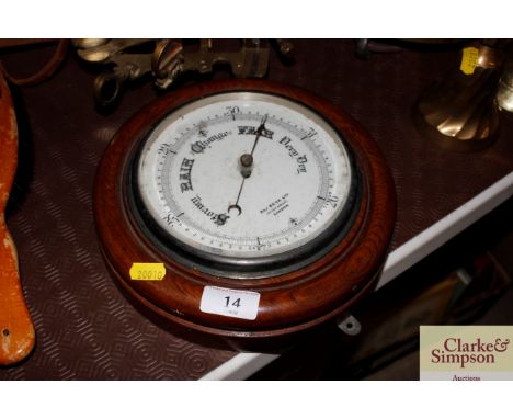 An oak cased aneroid barometer by R &amp; J Beck Cornhill, London