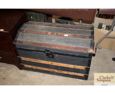A wooden and metal dome topped trunk