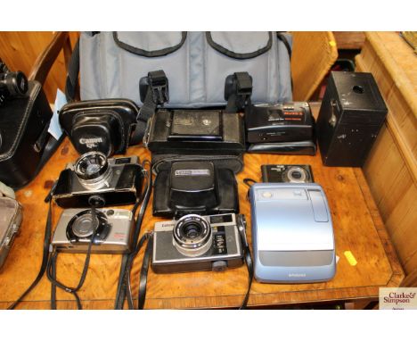 A camera bag and contents of miscellaneous cameras 