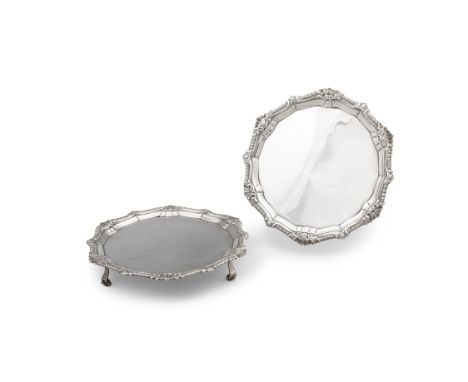 A PAIR OF GEORGE III IRISH SILVER SHAPED CIRCULAR CARD TRAYS, Dublin 1775, mark of Matthew West, the chased gadroon rim inter