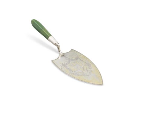 § A HISTORIC DUBLIN SILVER-GILT PRESENTATION TROWEL, Dublin 1792, the blade formed as an armorial with bright cut rim, the ce