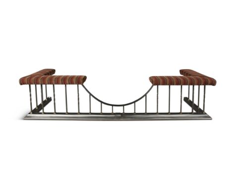 A LARGE VICTORIAN STEEL AND BRASS CLUB FENDER, the tapestry covered seat in stripped fabric on alternating square twist suppo