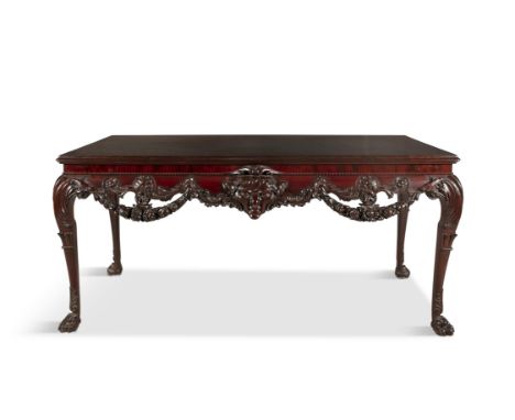 AN IRISH GEORGE II STYLE MAHOGANY SIDE TABLE BY HICKS OF DUBLIN, late 19th CENTURY, the moulded top over on a carved frieze w