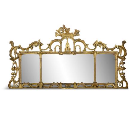 AN IRISH GEORGE II GILTWOOD OVERMANTEL MIRROR, MID-18TH CENTURYthe triple plate within pierced scrolled frame, surmounted by 