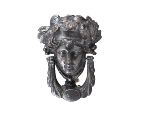 A STEEL DOOR KNOCKER IN THE FORM OF THE HEAD OF MERCURY. 20cm high