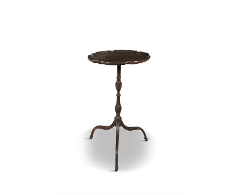 A GEORGE III PIE CRUST WINE TABLE, the top raised on turned and fluted centre pillar, and fluted tripod base. the top 40cm di