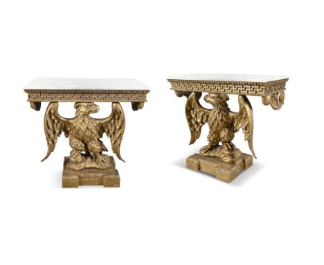 A PAIR OF 19TH CENTURY CARVED GILTWOOD CONSOLE TABLES, the white marble tops above above a Greek frieze supported by eagles o