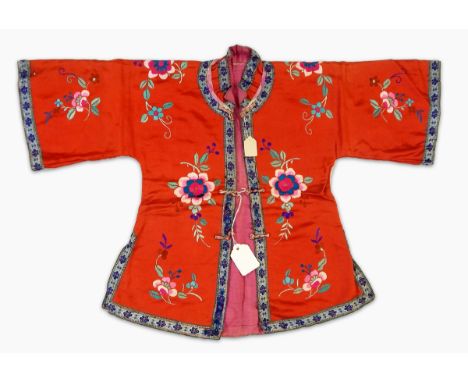 A Chinese child's embroidered red silk jacket and trousers with embroidered hat with metal Confucius monkeys and buttons, a c