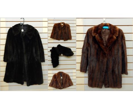 A musquash fur three-quarter length jacket, two vintage fur capes, a black dyed fox capelet and a black faux-fur full-length 