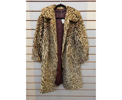 A faux-fur coat printed leopard pattern, a white faux-fur jacket labelled "Nylon Furleen" and a large selection of Kangol hat