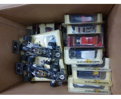 Approximately 26 Boxed Matchbox Models of Yesteryear die cast vehicles plus two loose Corgi John Player Special F1