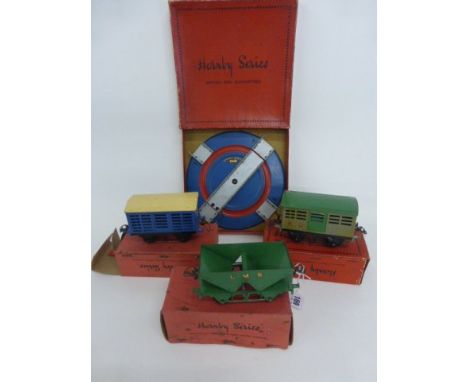 Four Boxed O Gauge Hornby Accessories Including No.1 Cattle Truck RS658, Turntable No.1 A857, Milk Traffic Van RS670 and RS66