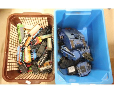 Basket of die cast Thomas the Tank Engine trains and a tub of model tanks