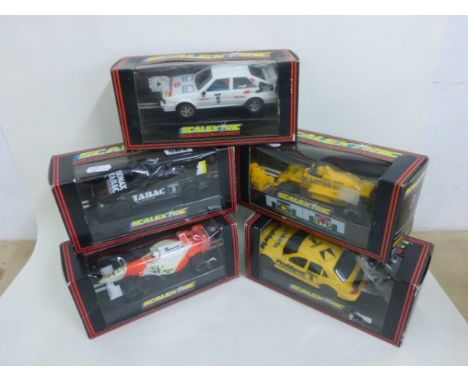 Five boxed Scalextric slot cars including C348 Audi Quattro, C467 Tyrrell, C585 McLaren Mercedes MP4/10 No 7, C601 Mercedes S